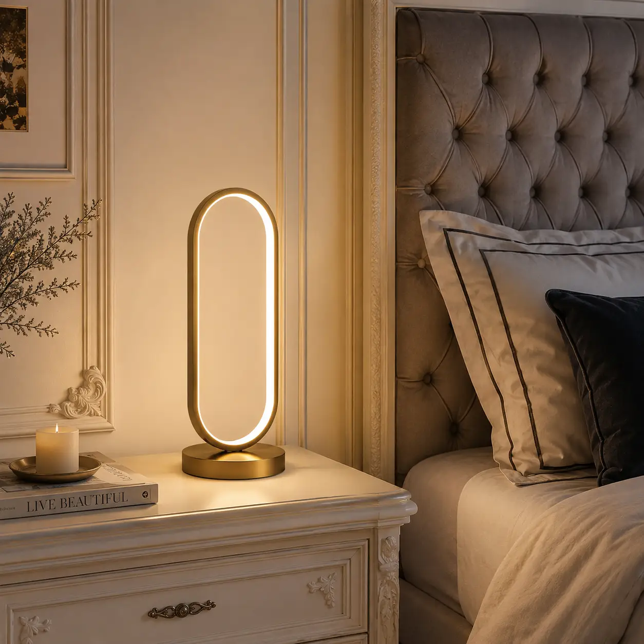 The Halo Oval LED Table Lamp in a French Chic Bedside Setting with Brushed Brass Finish