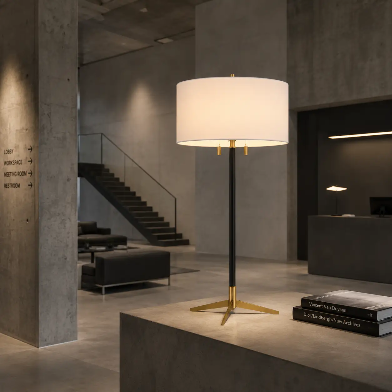 The Tripod Balance Dual Desk Lamp in a Matte Black Finish within an Industrial Minimalist Studio
